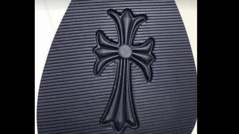 Commission Calls for Action against Company that Imported Shoes with a Cross on the Sole